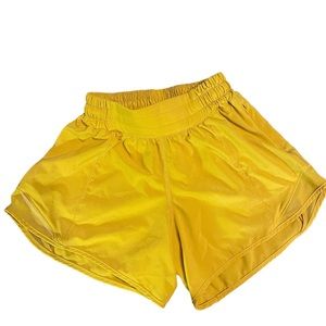 Lululemon hottie hot high rise shorts, yellow size 0 4”.  Liner cut off